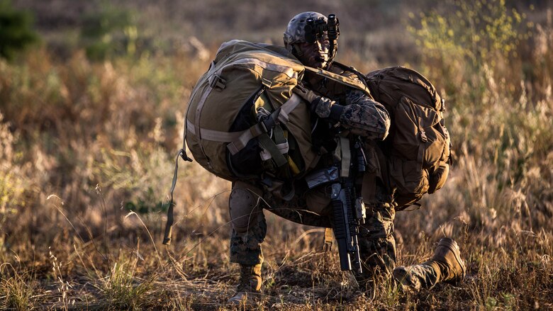 A reconnaissance man with the Maritime Raid Force, 11th Marine Expeditionary Unit, secures all of his gear to his body, to include his parachute, after an air insert onto an objective during a reconnaissance and surveillance mission at a MEU field exercise aboard Marine Corps Base Camp Pendleton, Calif., May 12, 2016. The MRF provides a number of unique capabilities for a MEU commander such as visit, board, search and seizure, reconnaissance and surveillance, and direct action raids. 