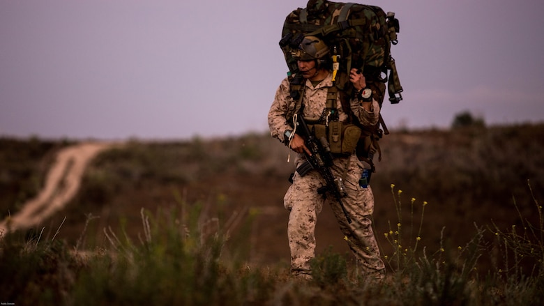 A reconnaissance man with the Maritime Raid Force, 11th Marine Expeditionary Unit, patrols to his objective during a reconnaissance and surveillance mission at a MEU field exercise aboard Marine Corps Base Camp Pendleton, Calif., May 12, 2016. Gathering intelligence through reconnaissance and surveillance is one of the many unique skillsets the Maritime Raid Force brings to the MEU. (Photo by Lance Cpl. Devan K. Gownas/Released)