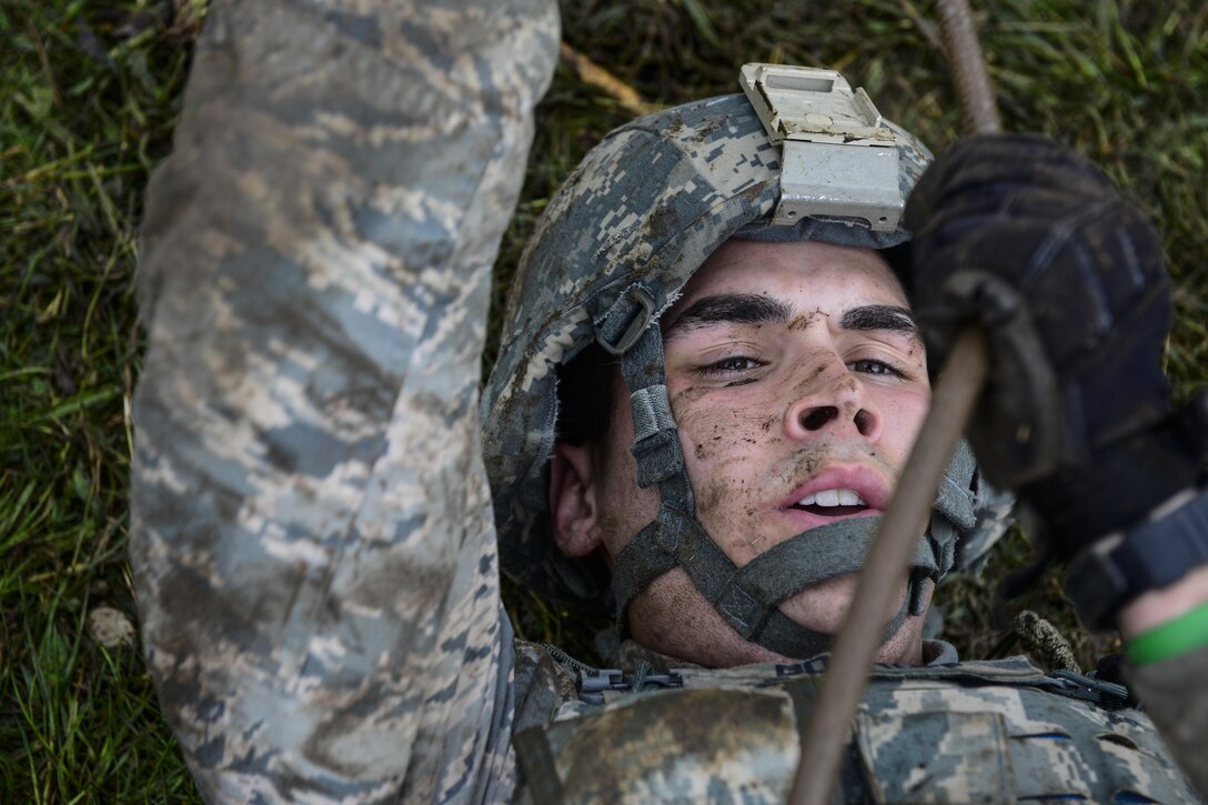Airman Nicholas Bogroff, 31st Security Forces Squadron security response team member, pulls weighted ammunition canisters during the Police Week Fire Team Challenge, May 19, 2016, at Aviano Air Base, Italy. During the week, ceremonies, memorials and other events took place to honor the men and women who have fallen in the line of duty. (U.S. Air Force photo by Senior Airman Krystal Ardrey/Released)