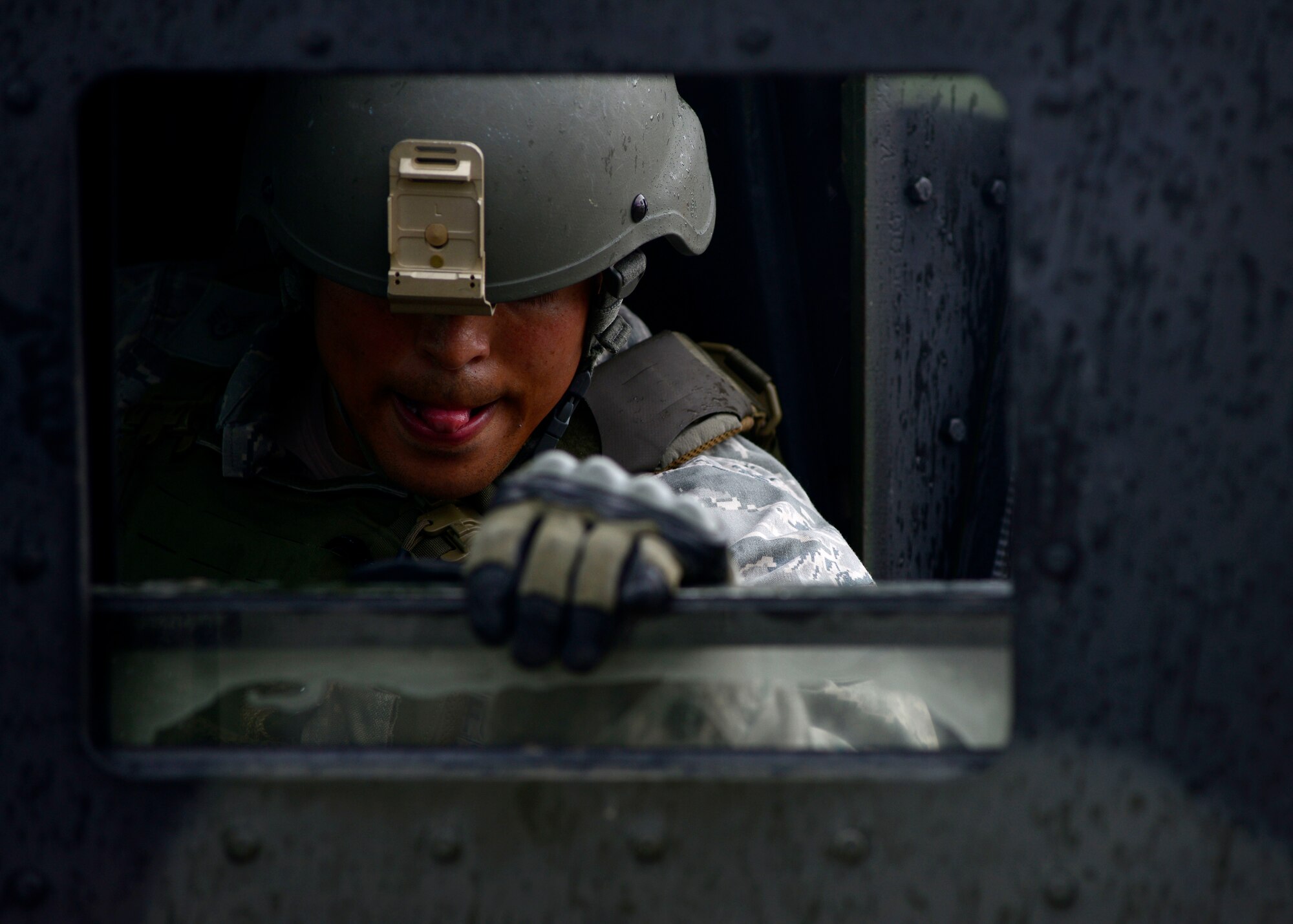Staff Sgt. Robert Rockhold, 31st Security Forces Squadron security forces team member, guides a Humvee during the Police Week Fire Team Challenge, May 19, 2016, at Aviano Air Base, Italy. The Humvee push was one of 12 stations testing the participants’ mental and physical strength. (U.S. Air Force photo by Senior Airman Areca T. Bell/Released)