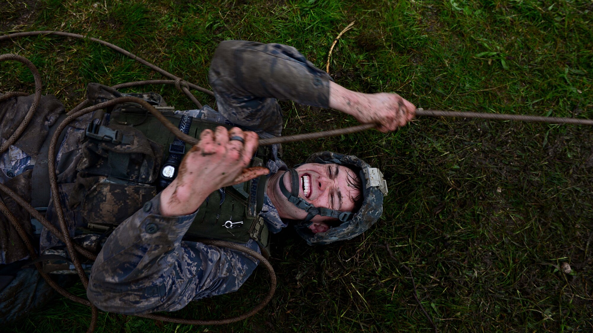 Senior Airman Samuel Harris, 31st Security Forces Squadron security forces team member, pulls weighted ammunition canisters during the Police Week Fire Team Challenge, May 19, 2016, at Aviano Air Base, Italy. During the week, ceremonies, a memorial and other events took place to honor the men and women who have served in the line of duty. (U.S. Air Force photo by Senior Airman Areca T. Bell/Released)