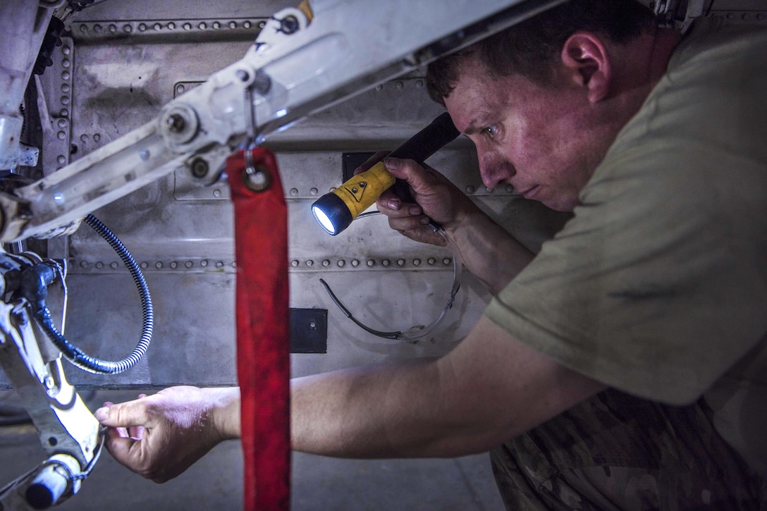 Air Force Tech. Sgt. Christopher Melrose inspects the interior wiring and cables on an F-16C Fighting Falcon during routine phase maintenance at Bagram Airfield, Afghanistan, May 18, 2016. Melrose is a phase technician assigned to the 455th Expeditionary Aircraft Maintenance Squadron. Air Force photo by Senior Airman Justyn M. Freeman