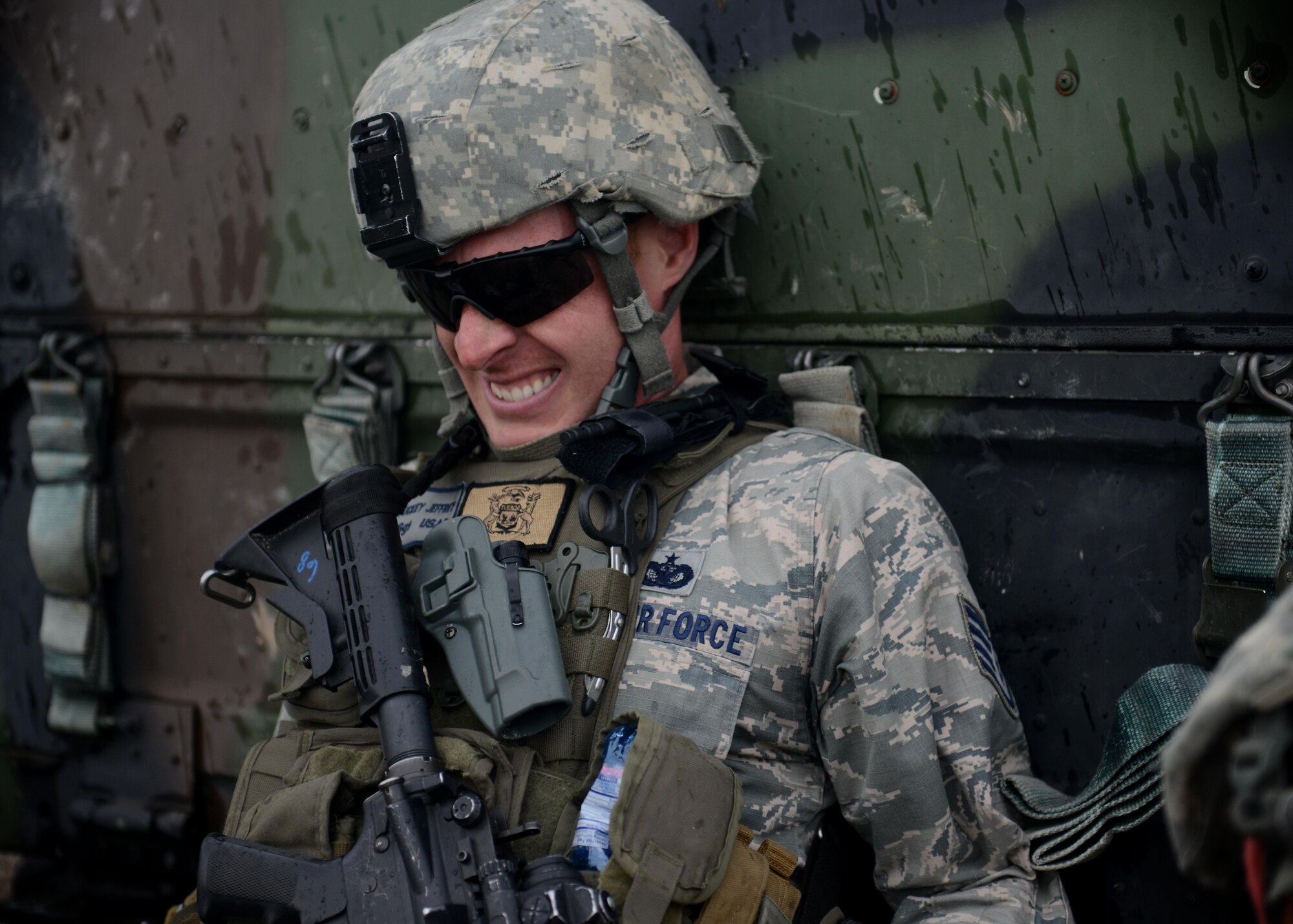 Staff Sgt. Jeffrey Tuckey, 31st Security Forces Squadron security forces team leader, pushes a Humvee during the Police Week Fire Team Challenge, May 19, 2016, at Aviano Air Base, Italy. During the week, ceremonies, a memorial and other events took place to honor the men and women who have served in the line of duty. (U.S. Air Force photo by Tech. Sgt. Evelyn Chavez/Released)