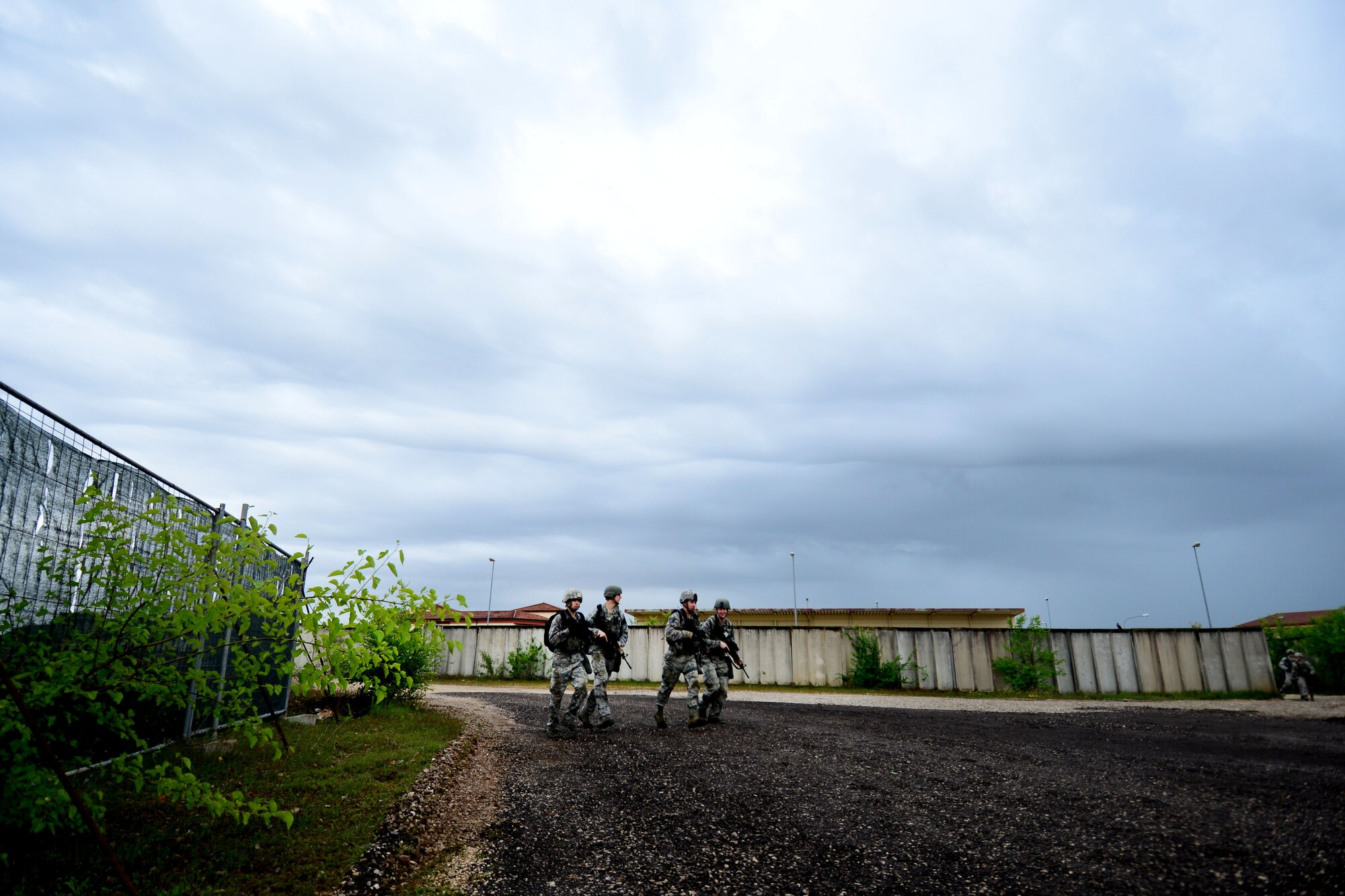 Airmen assigned to the 31st Security Forces Squadron, move between stations during the Police Week Fire Team Challenge, May 19, 2016, at Aviano Air Base, Italy. During the week, ceremonies, a memorial and other events took place to honor the men and women who have served in the line of duty. (U.S. Air Force photo by Tech. Sgt. Evelyn Chavez/Released)