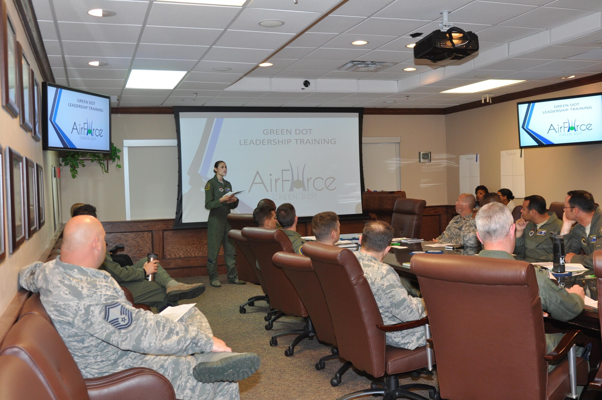 Capt. Afton Brown, 14th Flying Training Wing Green Dot Implementer, briefs base leadership during the first Green Dot leadership training session May 4 at Columbus Air Force Base, Mississippi. Green Dot helps organizations like the Air Force implement a violence prevention strategy that reduces power-based interpersonal violence, which includes sexual violence, domestic violence, dating violence, stalking, child abuse, elder abuse and bullying. (U.S. Air Force photo/Master Sgt. Amanda Savannah)