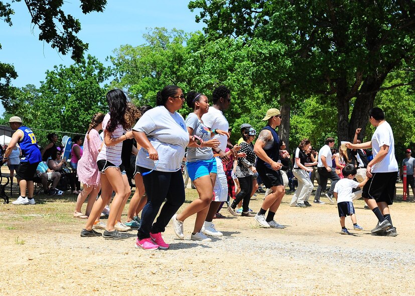 BLAZE Fest attendees step dance during BLAZE Fest May 14 on Columbus Air Force Base, Mississippi. Many people went to the dance floor following a Flash mob performance to dance to Top 40 hits along with classic party dances. (U.S Air Force photo/Senior Airman Stephanie Englar)