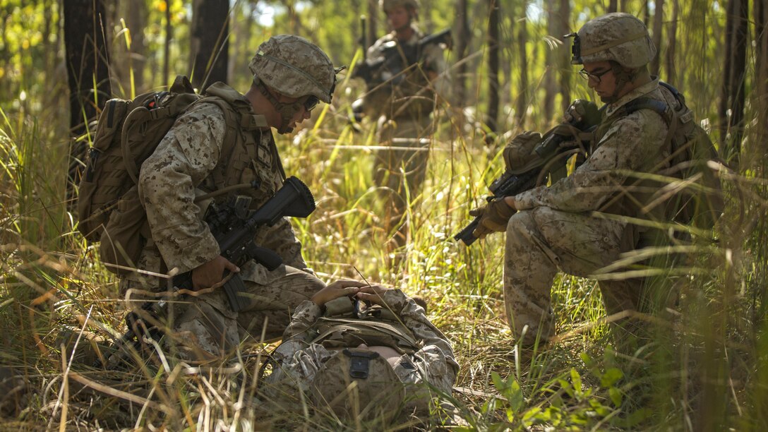 U.S. Marine riflemen provide field care to a simulated casualty in a training area outside of Robertson Barracks, Northern Territory, Australia, May 20, 2016. Marines with Marine Rotational Force - Darwin simulated causality evacuations with a UH-1Y Venom helicopter. MRF-D is a six-month deployment of Marines into Darwin, Australia, training in a new environment. The Marines are with Company B, 1st Battalion, 1st Marine Regiment, MRF-D.