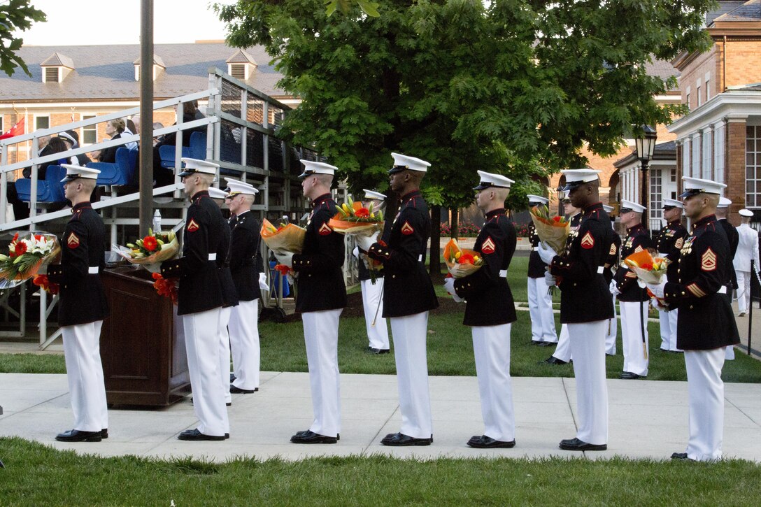 Marines from Marine Barracks Washington, D.C., prepare to present flowers and gifts to family members of Lt. Gen. Robert E. Schmidle Jr. during his retirement ceremony, May 19, 2016. Schmidle was appointed as the Principle Director of Cost Assessment and Program Evaluations, Office of the Secretary of Defense in March of 2014, where he was responsible for analyzing and evaluating plans, programs and budgets in relation to U.S. defense objectives. (Official Marine Corps photo by Cpl. Chi Nguyen/Released)