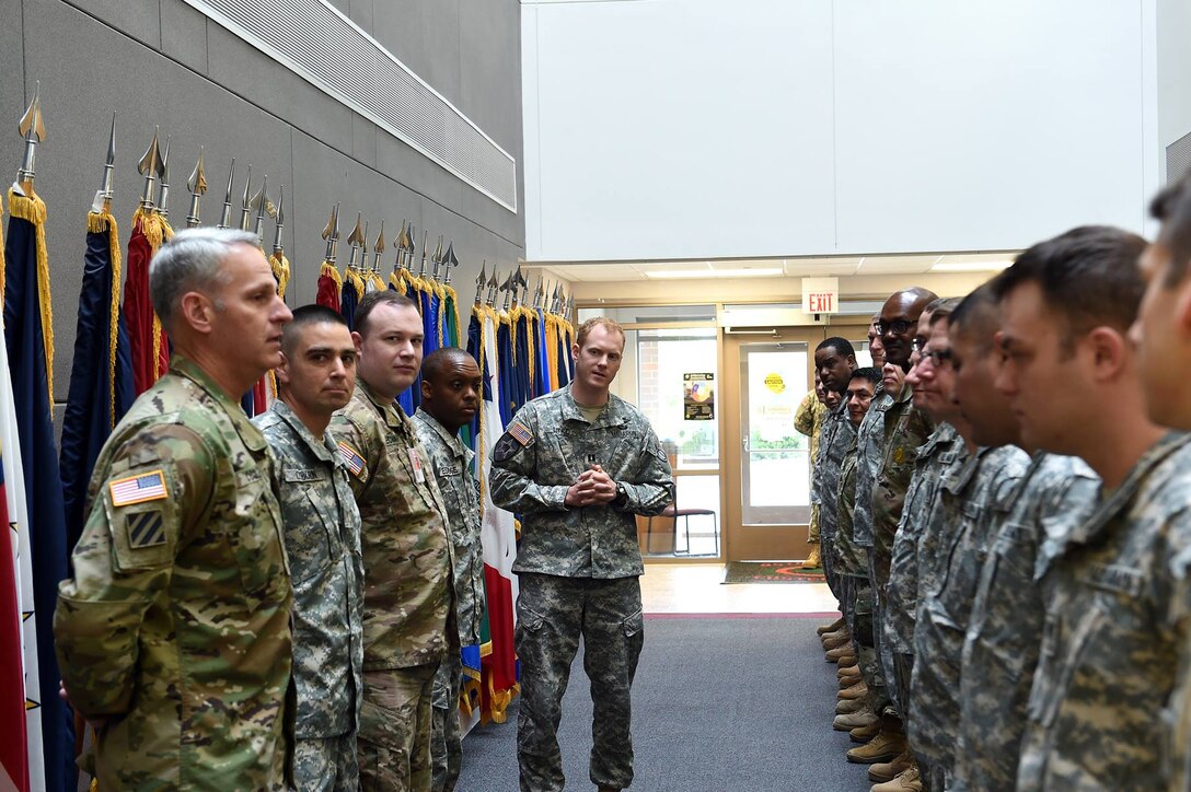Several newly assigned soldiers introduce themselves during the 85th Support Command's May battle assembly, May 15, 2016. Among them was Col. Robert Cooley, Deputy Commander, 85th Support Command.
(Photo by Spc. David Lietz)