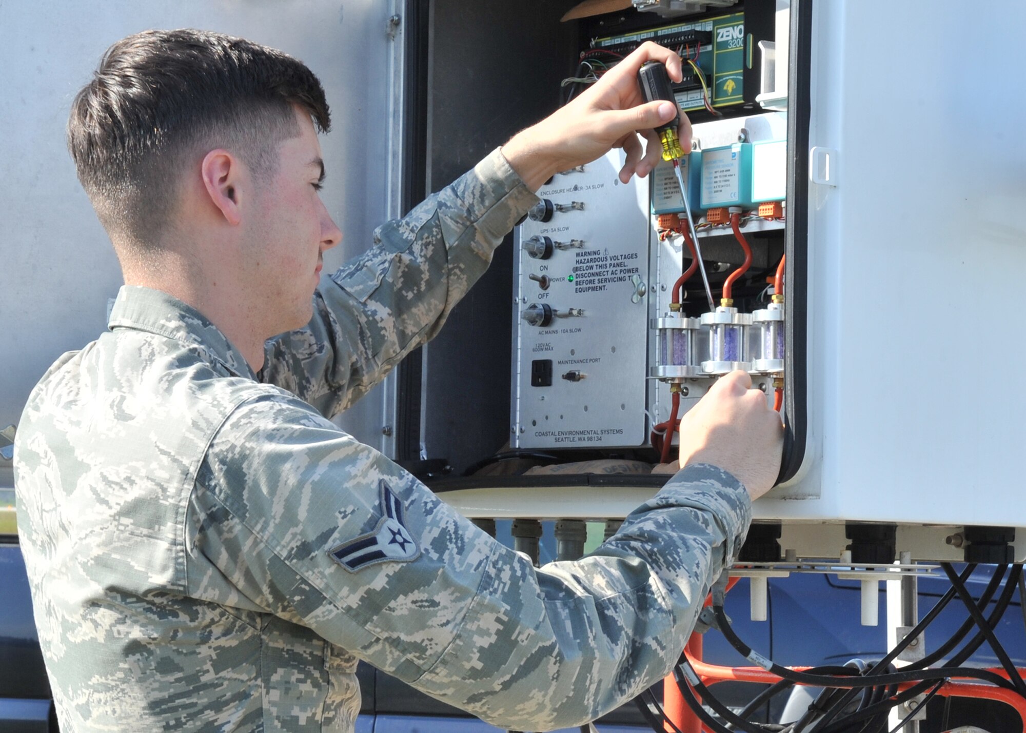 Airman 1st Class Logan Haley, 325th Operations Support Squadron airfield systems technician, performs a preventative maintenance inspection on the FMQ-19 weather system on the Tyndall flight line May 12. The equipment they maintain directly supports all of Tyndall's aircraft operations by providing precision approach, aircraft guidance, weather information and pilot to ground communication capabilities to the Radar Approach Control Facility and the Air Traffic Control Tower. (U.S. Air Force photo by Senior Airman Ty-Rico Lea/Released)