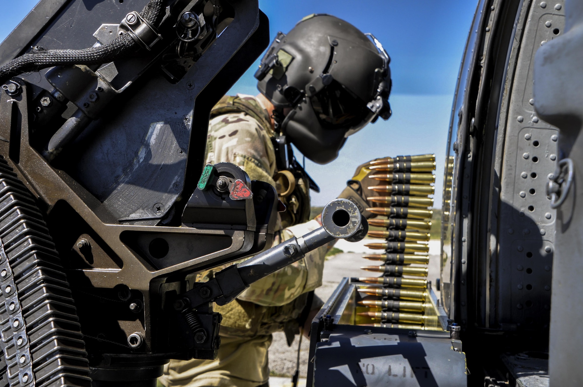 A special mission aviator loads .50-caliber ammunition on an HH-60G Pave Hawk during the 34th Weapons Squadron’s Terminal Employment phase in Boise Idaho, on April 19. The TE phase teaches Pave Hawk pilots and SMAs advanced aircraft and weapons employment tactics in the final stage of a rescue mission. 