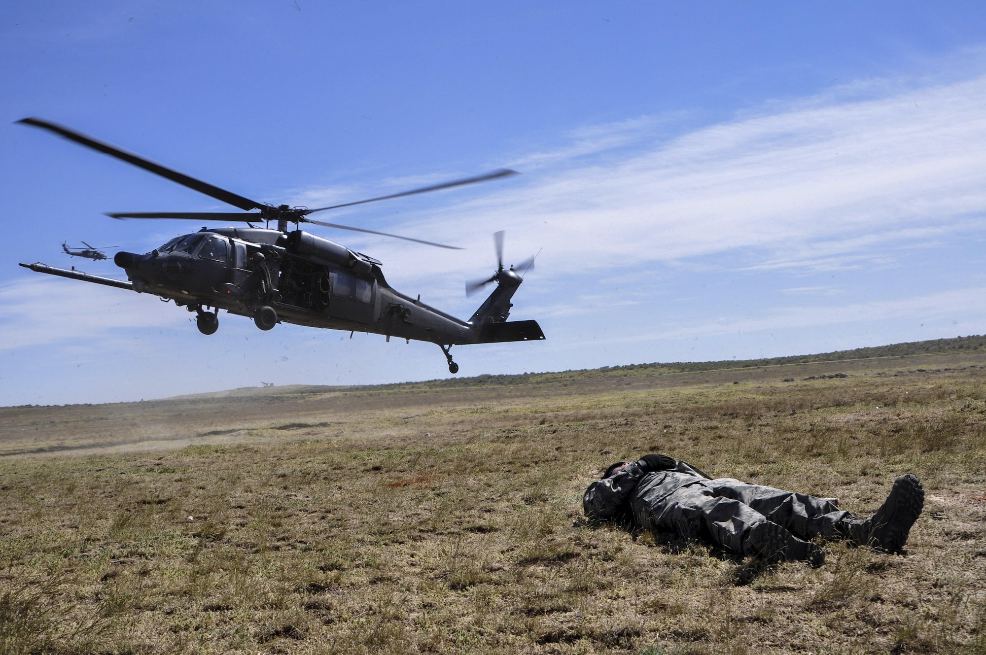 Two HH-60G Pave Hawk combat search and rescue crews prepare to extract a simulated downed service member from the Orchard Range Training Complex in Boise, Idaho, on April 20 during the 34th Weapons Squadron’s Terminal Employment phase. The TE phase teaches Pave Hawk pilots and special mission aviators advanced aircraft and weapons employment tactics in the final stage of a rescue mission.