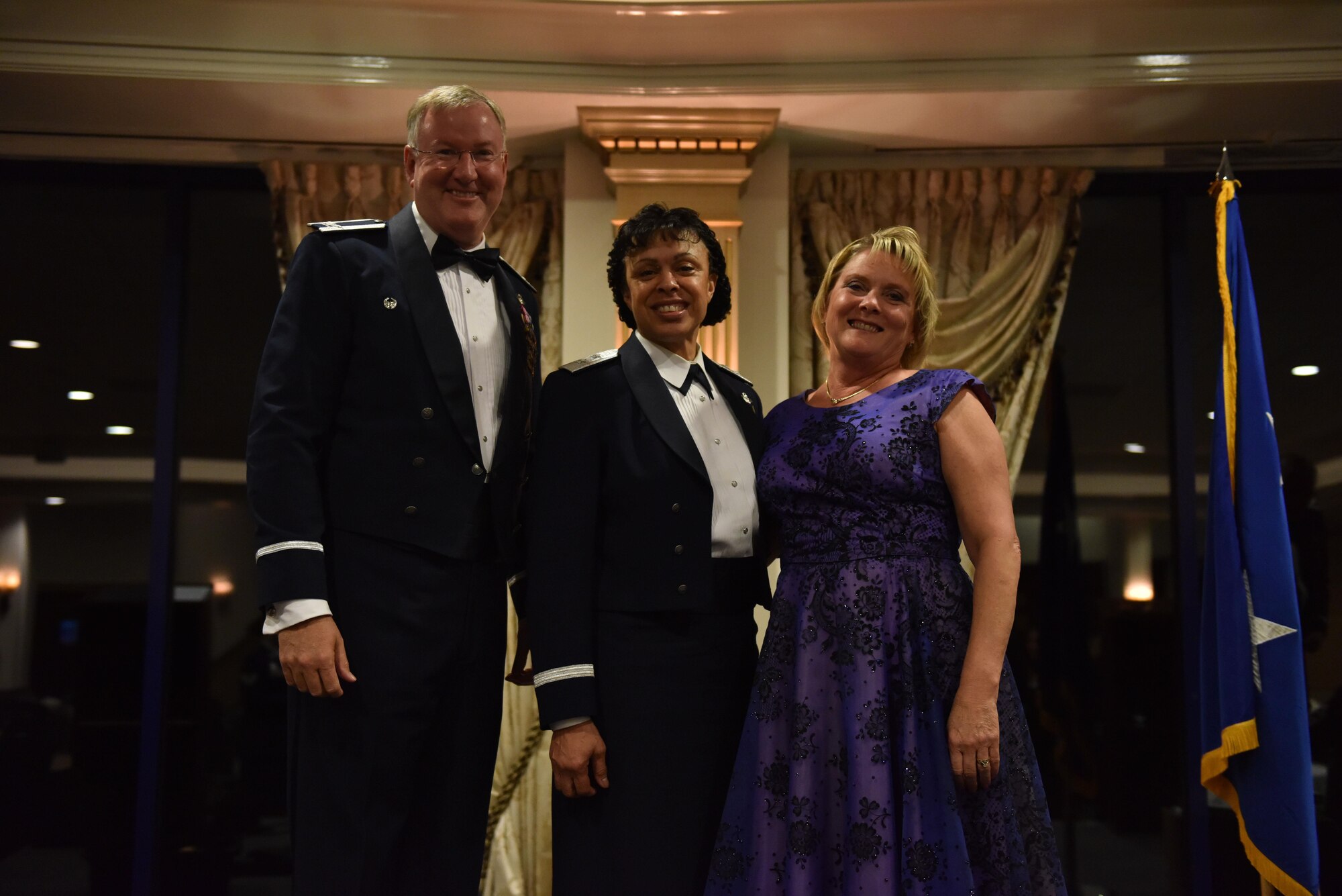 Maj. Gen. Stayce D. Harris, commander of the 22nd Air Force, Col. Jeff A. Van Dootingh, 911th Airlift Wing commander, and his wife, Diana Van Dootingh, stand for a photo at the 911th Airlift Wing’s annual awards banquet at the Club at Shadow Lakes, Aliquippa, Pa., May 14, 2016. The awards banquet celebrated the accomplishments of 911th AW members during the year of 2015.  (U.S. Air Force photo by Airman Bethany Feenstra)