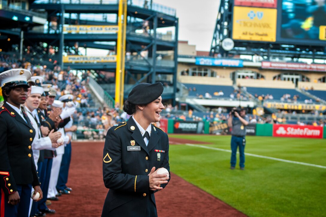 Private 1st. Class Kristyn Howell, an information technology specialist with the 316th Sustainment Command (Expeditionary), runs on the field of the Pittsburgh Pirates baseball team at PNC Park in Pittsburgh, Pa., May 19, 2016. The Pirates hosted the first Military Takes the Field night at PNC Park to honor members of all branches of the military (U.S. Army photo by Staff Sgt. Dalton Smith/Released)