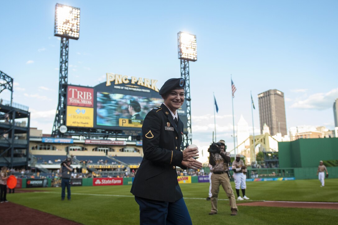 Private 1st. Class Kristyn Howell, an information technology specialist with the 316th Sustainment Command (Expeditionary), runs on the field of the Pittsburgh Pirates baseball team at PNC Park in Pittsburgh, Pa., May 19, 2016. The Pirates hosted the first Military Takes the Field night at PNC Park to honor members of all branches of the military (U.S. Army photo by Staff Sgt. Dalton Smith/Released)