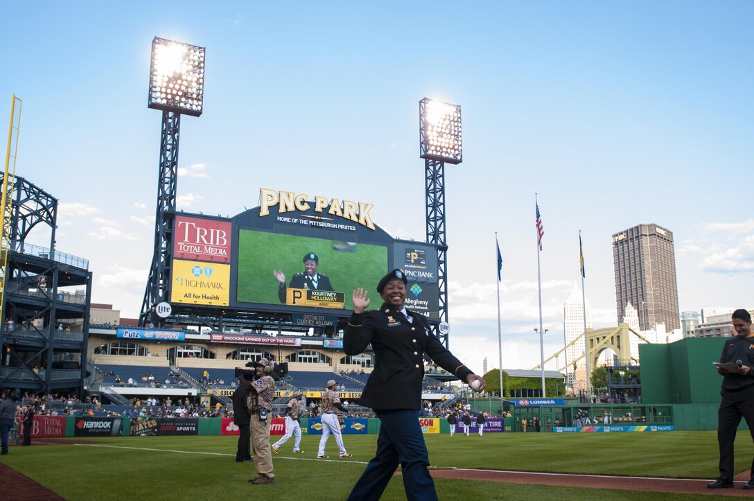 Spc. Kortney Holloway, a signal support systems specialist with the 316th Sustainment Command (Expeditionary), runs on the field of the Pittsburgh Pirates baseball team at PNC Park in Pittsburgh, Pa., May 19, 2016. The Pirates hosted the first Military Takes the Field night at PNC Park to honor members of all branches of the military (U.S. Army photo by Staff Sgt. Dalton Smith/Released)
