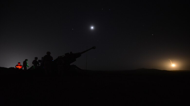 Students at the Field Artillery Basic Officers Leadership Course conduct night fires with a M77A2 Howitzer at Fort Sill, Oklahoma, May 11, 2016. Students at the course learn how to use illumination rounds to help find targets in the dark. 