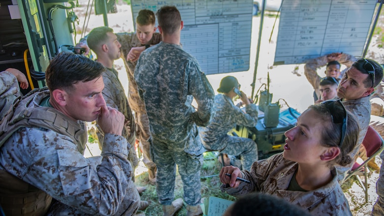 Second Lt. Katherine Boy, right, leads a fire direction center at the Field Artillery Basic Officers Leadership Course at Fort Sill, Oklahoma, May 12, 2016. The fire direction center is responsible for calculating and transmitting fire coordinates to the gun line.