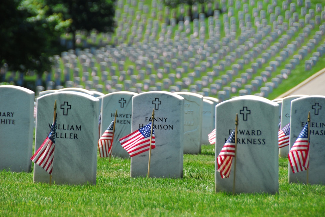 Memorial Day flags adorn headstones in Section 27, one of Arlington National Cemetery’s oldest sections.