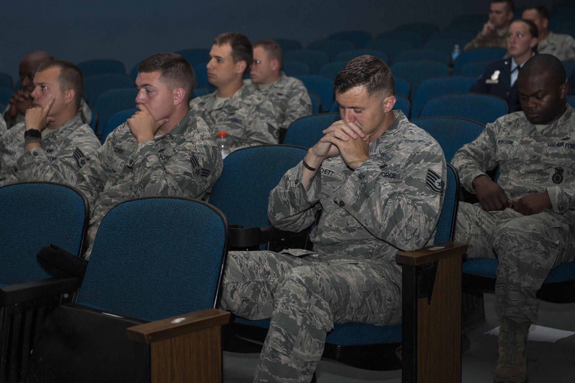 U.S. Air Force Airmen from the 23d Security Forces Squadron remember their fallen comrades as their names are recited during a retreat ceremony, May 20, 2016, at Moody Air Force Base, Ga. During the event, the names were read of all fallen Security Forces members since Operation Enduring Freedom, along with all fallen local law enforcement officers within the last year. (U.S. Air Force photo by Airman 1st Class Lauren M. Hunter/Released)