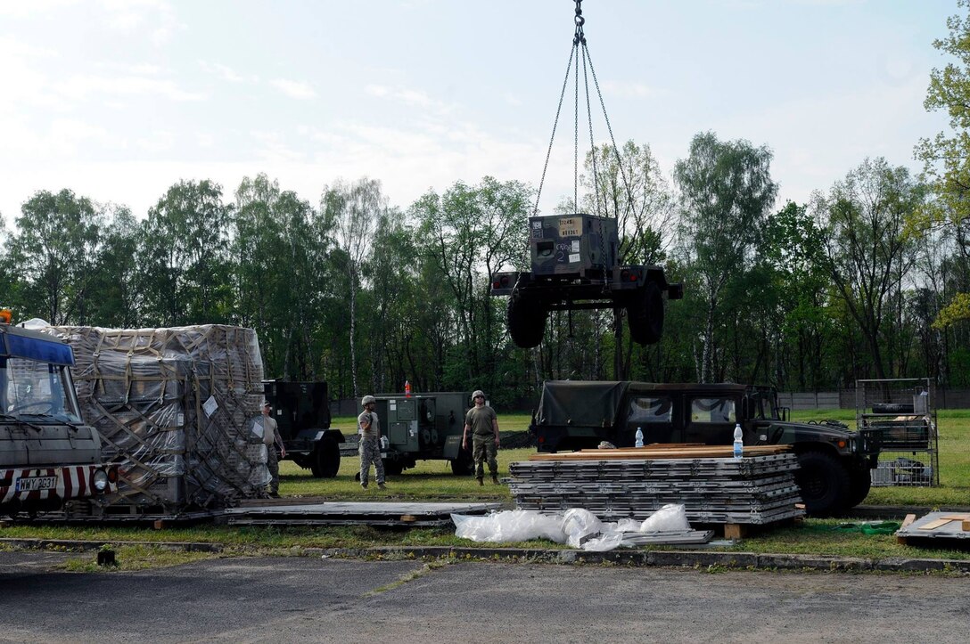 U.S. Army Reserve Soldiers with the 364th Expeditionary Sustainment Command set up their tactical operations center near Warsaw, Poland, May 13, in preparation of Exercise Anakonda 16. The 364th is the largest U.S. Army Reserve contingent participating in Anakonda 16, a Polish-led, joint multinational exercise taking place throughout Poland from June 7-17. The exercise involves more than 25,000 participants from 24 nations is a premier training event for U.S. Army Europe and our Allied partners. (U.S. Army photo by Maj. Marvin Baker/364th Expeditionary Sustainment Command) (Released)