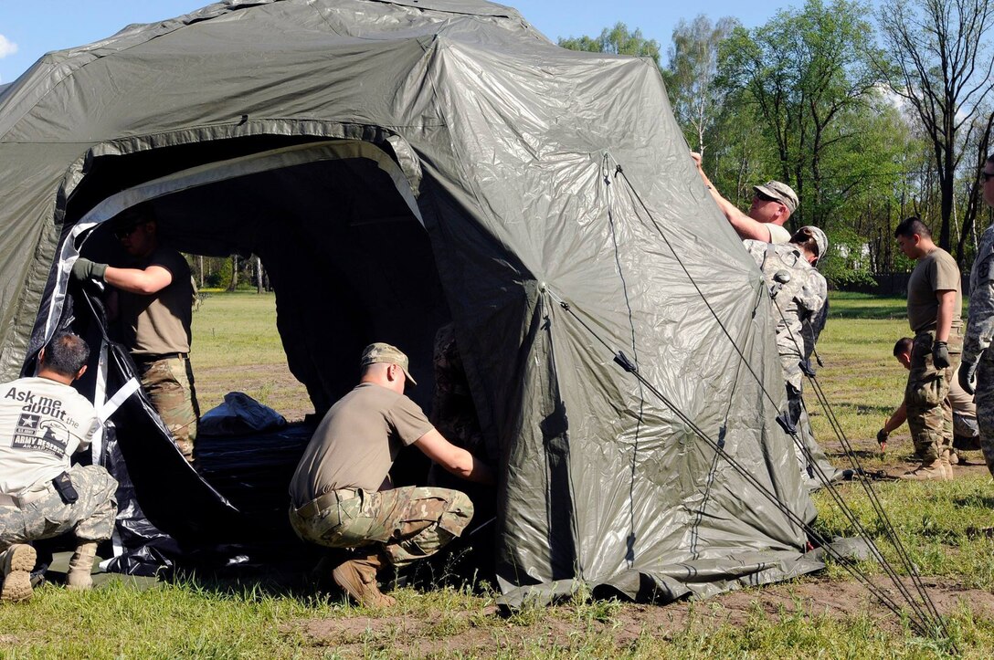 U.S. Army Reserve Soldiers with the 364th Expeditionary Sustainment Command set up their tactical operations center near Warsaw, Poland, May 13, in preparation of Exercise Anakonda 16. The 364th is the largest U.S. Army Reserve contingent participating in Anakonda 16, a Polish-led, joint multinational exercise taking place throughout Poland from June 7-17. The exercise involves more than 25,000 participants from 24 nations is a premier training event for U.S. Army Europe and our Allied partners. (Army photo by Maj. Marvin Baker/364th Expeditionary Sustainment Command) (Released)