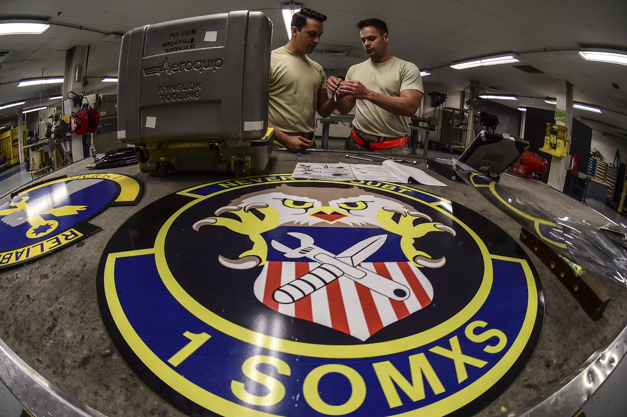 Staff Sgt. James Griffith, left, and Staff Sgt. David Sidatt, aircraft structural maintenance Airmen with the 1st Special Operations Maintenance Squadron, perform an inspection on aircraft parts at Hurlburt Field, Fla., May 17, 2016. Airmen with the 1st SOMXS aircraft structural maintenance shop save the Air Force more than $100,000 a year by replacing damaged parts with items fabricated in their shop. (U.S. Air Force photo by Staff Sgt. Christopher Callaway) 