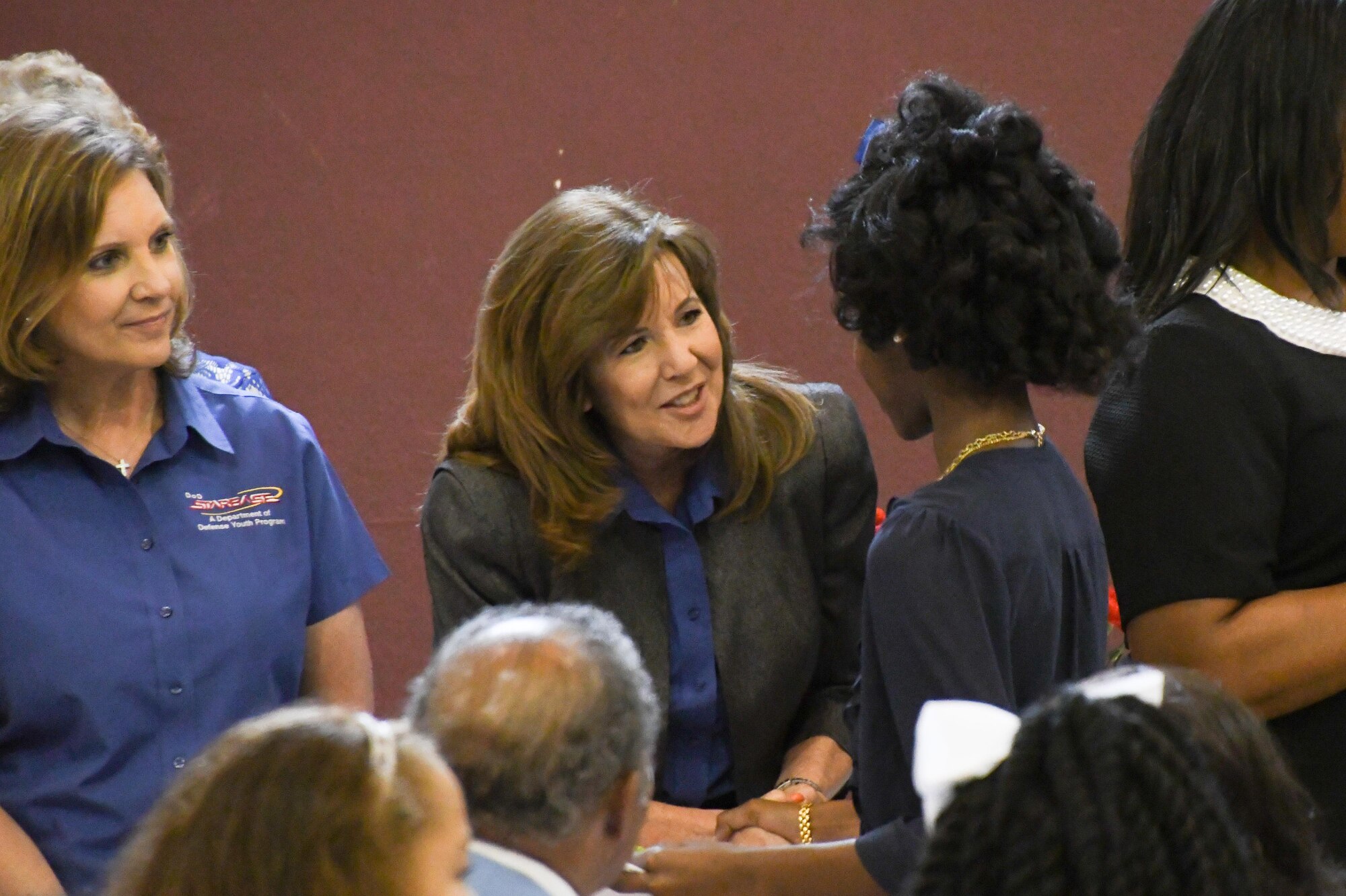 A graduate of the 1,000th STARBASE Louisiana class at Judson Fundamental Elementary Magnet School in Shreveport, La. receives congratulations from Kathy Brandon, director of STARBASE Louisiana. The STARBASE program encourages students to actively engage in STEM (science, technology, engineering, and mathematics) exploration and pursue these areas in future studies. (U.S. Air Force photo by Master Sgt. Dachelle Melville/Released)