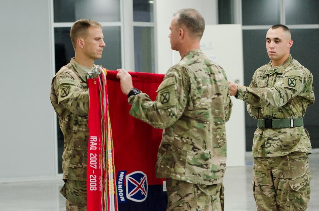 Col. Scott Naumann and Command Sgt. Maj. Timothy Rose, the command team of Task Force Warrior, case the colors of the 1st Brigade, 10th Mountain Division “Warriors,” during a transfer of authority ceremony in Erbil, Iraq, May 17, 2016. The Warrior brigade completed a nine-month deployment in Iraq as part of Combined Joint Forces Land Component Command – Operation Inherent Resolve, building partner capacity, and advising and assisting Iraqi Security Forces.  The building partner capacity mission aims to increase the military capacity of local forces fighting the Islamic State of Iraq and the Levant.
