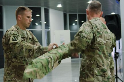 Col. Scott Naumann and Command Sgt. Maj. Timothy Rose, the command team of Task Force Warrior, furl the colors of the 1st Brigade, 10th Mountain Division “Warriors,” during a transfer of authority ceremony in Erbil, Iraq, May 17, 2016. The Warrior brigade completed a nine-month deployment in Iraq as part of Combined Joint Forces Land Component Command – Operation Inherent Resolve, building partner capacity, and advising and assisting Iraqi Security Forces.  The building partner capacity mission aims to increase the military capacity of local forces fighting the Islamic State of Iraq and the Levant.