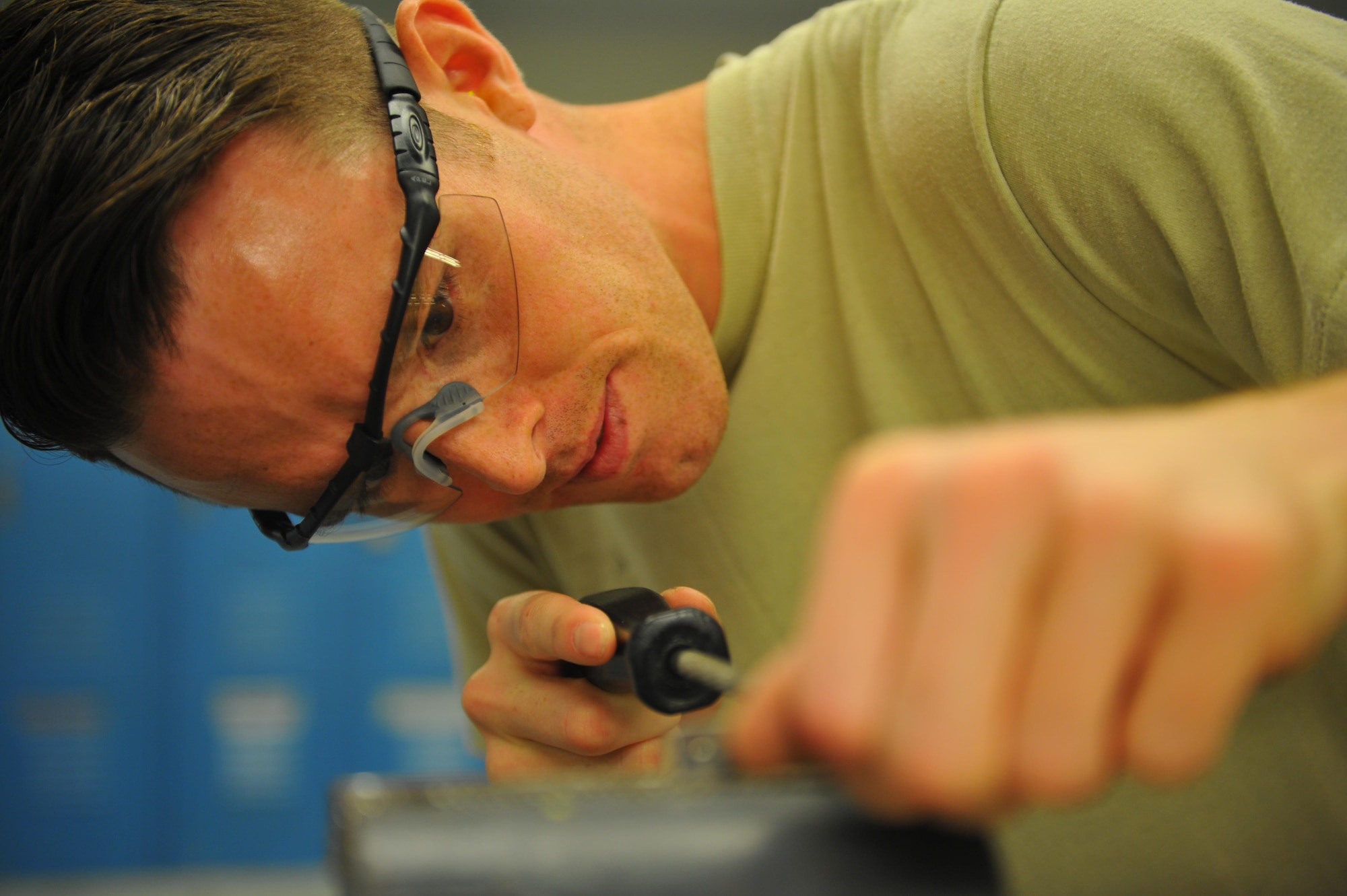 Staff Sgt. Patrick Hanrahan, an aircraft maintenance Airman with the 1st Special Operations Maintenance Squadron, files down a part for a C-130 wing flap at Hurlburt Field, Fla., May 17, 2016. Airmen with the SOMXS aircraft structural maintenance shop save the Air Force more than $100,000 a year, replacing damaged parts with items fabricated in their shop. (U.S. Air Force photo by Airman 1st Class Joseph Pick)