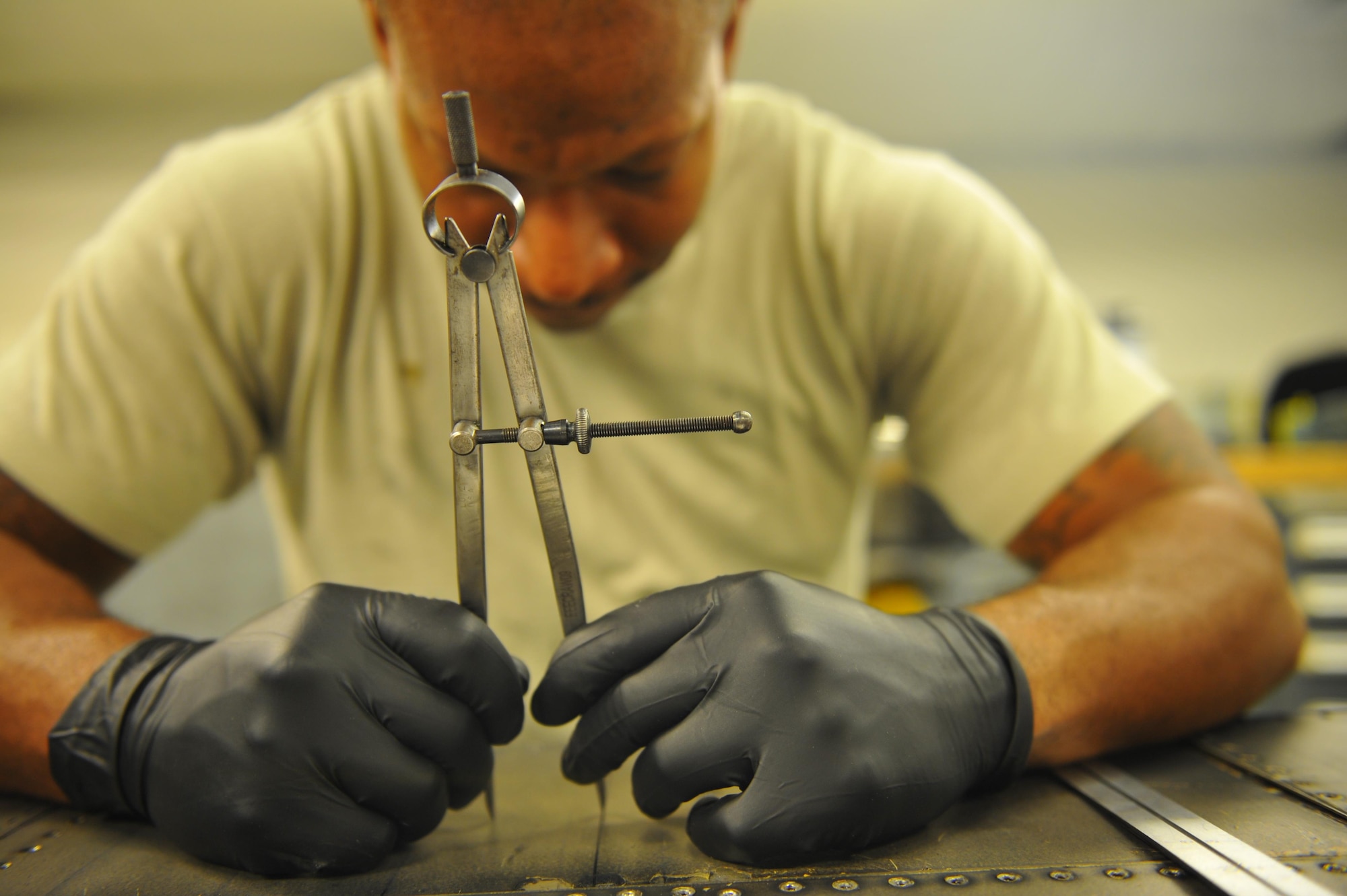 Staff Sgt. Sean Ciccel, an aircraft structure maintenance craftsman with the 1st Special Operations Maintenance Squadron, uses a compass to measure a C-130 wing flap at Hurlburt Field, Fla., May 17, 2016. The 1st SOMXS Airmen construct aircraft parts forthe CV-22 Osprey, AC-130U Spooky, MC-130H Combat Talon II and the AC-130J Ghostrider, keeping Hurlburt's aircraft combat ready. (U.S. Air Force photo by Airman 1st Class Joseph Pick)
