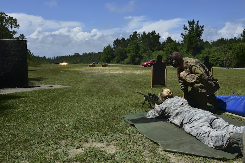 Maj. Martie Fredericks-Lenhart, a strategic analyst with the Air Force Special Operations Command Operations Center, fires a sniper rifle, May 18, 2016. The award winners toured Hurlburt Field May 17 and 18  before being honored at the yearly awards banquet held May 19 to celebrate their accomplishments. (U.S. Air Force photo by Senior Airman Jeff Parkinson)