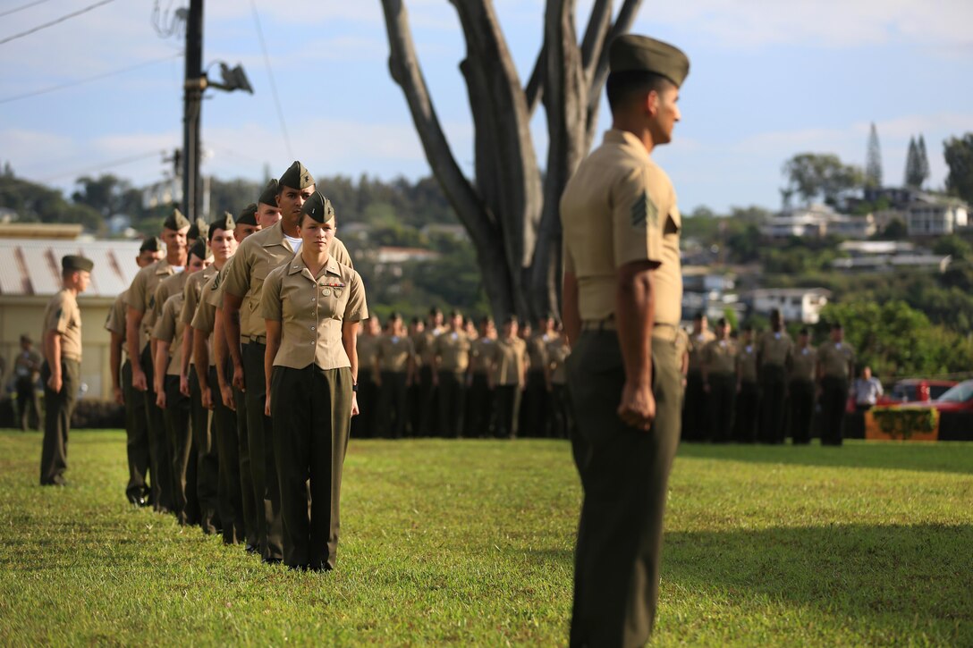 U.S. Marine Corps Forces, Pacific Marines march into place during a battalion formation on Camp H.M. Smith, Hawaii, May 6, 2016. The formation was held to award the Marines of MARFORPAC a Meritorious Unit Commendation, the shooting team the Master Gunnery Sgt. Michael T. Finn trophy for winning the Pacific Division pistol matches, and the MARFORPAC Band the U.S. Marine Corps Band of the Year trophy. 