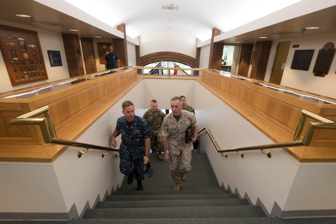 Marine Corps Gen. Joe Dunford, front right, chairman of the Joint Chiefs of Staff, walks with Navy Rear Adm. Randy B. Crites, commander of Submarine Group 10, at Naval Submarine Base Kings Bay, Ga., May 20, 2016. Dunford visited the base to gain perspective on the sea portion of the nuclear triad. DoD photo by D. Myles Cullen