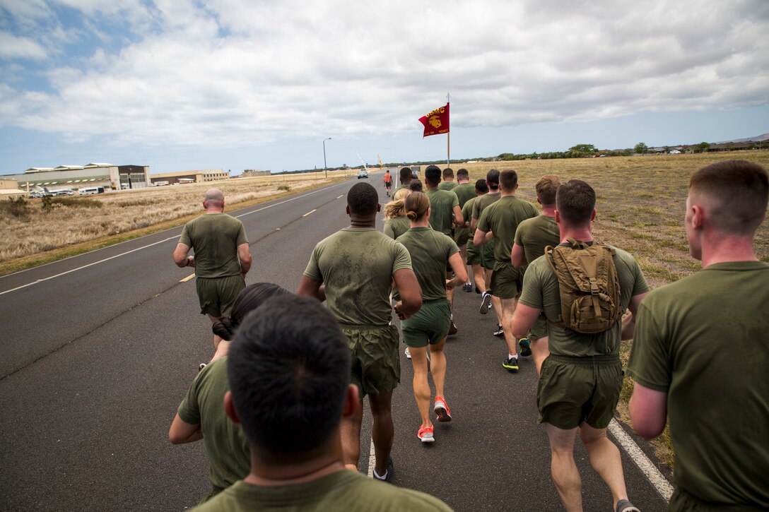 Marines from U.S. Marine Corps Forces, Pacific and Marine Corps Base Hawaii run in a Memorial 5K run in honor of Cpl. Sara Medina and Lance Cpl. Jacob Hug, aboard Ford Island, Hawaii, May 11, 2016. Medina and Hug lost their lives May 12, 2015, assisting in Operation Sahayogi Haat “Helping Hand” after the earthquakes in Nepal. Public Affairs and Combat Camera Marines across the Marine Corps began the memorial run simultaneously. 