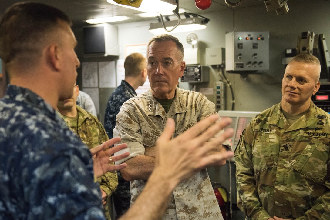 Marine Corps Gen. Joe Dunford, chairman of the Joint Chiefs of Staff, and Army Command Sgt. Maj. John W. Troxell, right, the chairman's senior enlisted advisor, receive a briefing on submarine training at the Trident Training Facility at Naval Submarine Base Kings Bay, Ga., May 20, 2016. DoD photo by D. Myles Cullen