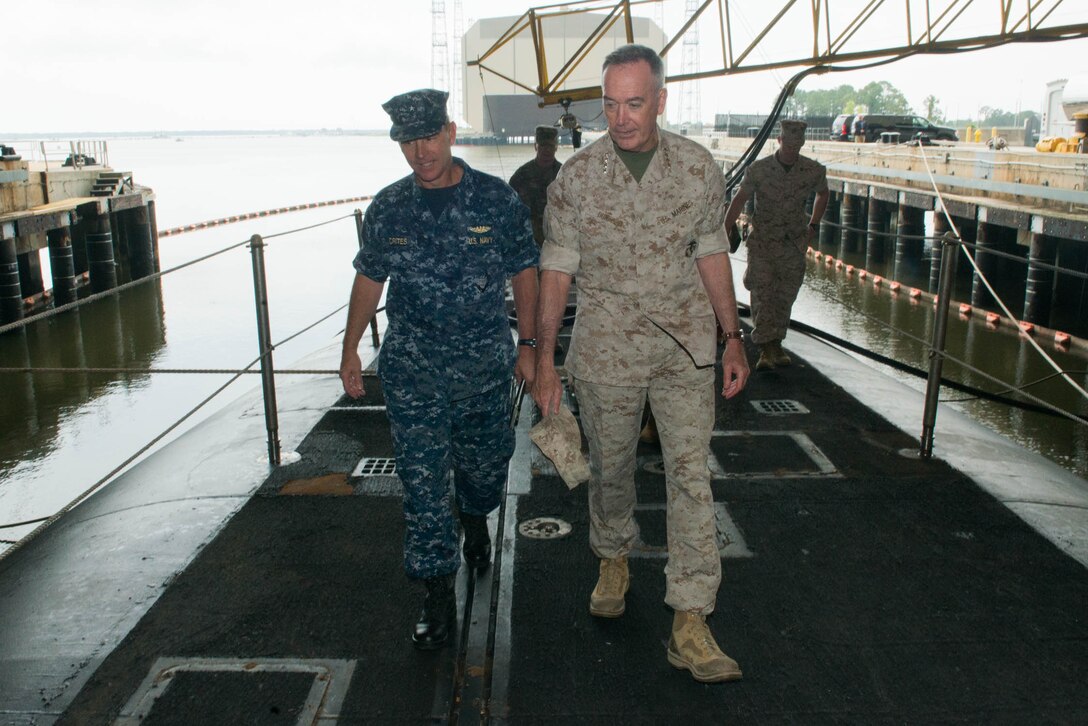 Marine Corps Gen. Joe Dunford, right, chairman of the Joint Chiefs of Staff, walks with Navy Rear Adm. Randy B. Crites, commander of Submarine Group 10, for a tour of the Ohio-class ballistic missile submarine USS Alaska at Naval Submarine Base Kings Bay, Ga., May 20, 2016. DoD photo by D. Myles Cullen
