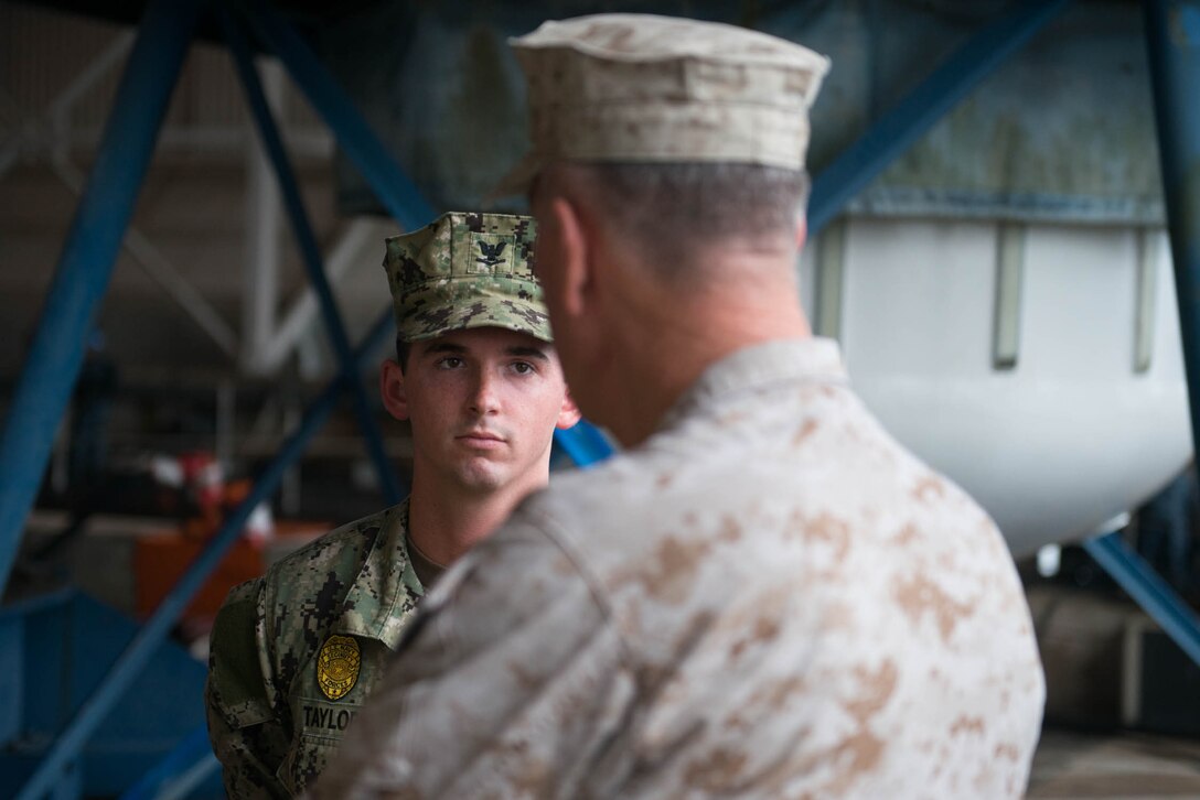 Marine Corps Gen. Joe Dunford, chairman of the Joint Chiefs of Staff, talks with a sailor while visiting Naval Submarine Base Kings Bay, Ga., May 20, 2016. DoD photo by D. Myles Cullen