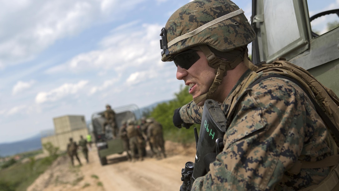 Cpl. William Worthy, a squad leader with 4th Law Enforcement Battalion, Force Headquarters Group, Marine Forces Reserve, yells for his team to dismount and set up security during exercise Platinum Wolf 2016 at Peacekeeping Operations Training Center South Base, Bujanovac, Serbia, May 19, 2016. The Marines are working with the partner nations of Bosnia, Bulgaria, Macedonia, Montenegro, Slovenia and Serbia during the final field exercise. The exercise aims to ensure the nations master peacekeeping operations and focus on learning non-lethal weapons
