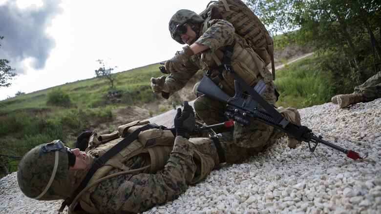 HM3 Ryan Loomis, a hospital corpsman with 4th Law Enforcement Battalion, Force Headquarters Group, Marine Forces Reserve, applies a tourniquet to a simulated casualty during exercise Platinum Wolf 2016 at Peacekeeping Operations Training Center South Base, Bujanovac, Serbia, May 19, 2016. The Marines are working with partner nations of Bosnia, Bulgaria, Macedonia, Montenegro, Slovenia and Serbia during the final field exercise where they master patrols, military operation urban terrain training, and building their interoperability.