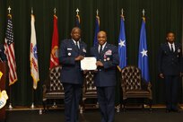 Maj. Gen. Mark Brown, 2nd Air Force commander,left, presents Brig. Gen. Trent Edwards, 37th Training Wing commander from June 20, 2014 to May 20, 2016, the Legion of Merit award May 20, 2016,at Joint Base San Antonio-Lackland, Texas. Edwards is headed to Peterson Air Force Base, Colo., where he will be the Director of Financial Management and Comptroller for Air Force Space Command.