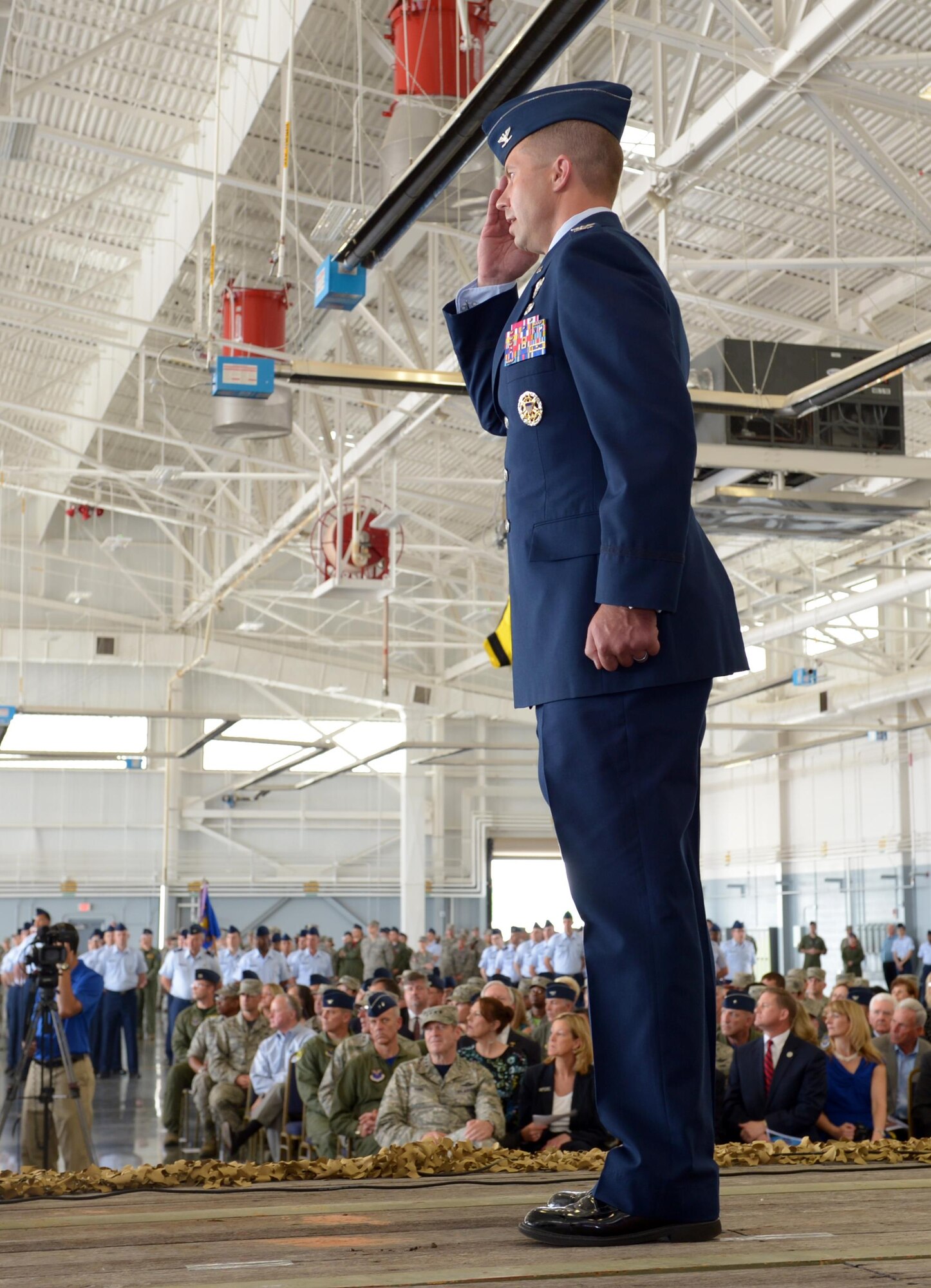 Col. Ty Neuman, 2nd Bomb Wing commander, renders a first salute to his new Airmen during a change of command ceremony at Barksdale Air Force Base, La., May 20, 2016. As commander, he will support 32 tenant units, including headquarters Air Force Global Strike Command, headquarters 8th Air Force and Air Force Reserve Command's 307th Bomb Wing. (U.S. Air Force photo/Senior Airman Curt Beach)