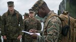 Master Sgt. Leroy A. Forbes reads off names for accountability for Task Force Koa Moana at Tengan Pier, Okinawa, Japan on May 18, 2016. The task force is responsible for conducting a series of bilateral, multi-national exercises involving a company-sized element of Marines and Sailors from different units within III Marine Expeditionary Force. They will be traveling to countries in the Asia-Pacific region aboard the USNS Sacagawea, a Marine Prepositioning Force ship. The ship is normally a mobile warehouse for Marines’ supplies; however, during this exercise, it will serve to transport personnel to multiple nations, where they will conduct basic military training and cultural exchange to increase relations and interoperability between participating nations. Forbes, from Hartford, Conn., is a combat engineer with 9th Engineer Support Battalion, 3rd Marine Logistics Group, III Marine Expeditionary Force, and is the task force’s senior enlisted in charge for the series of exercises.