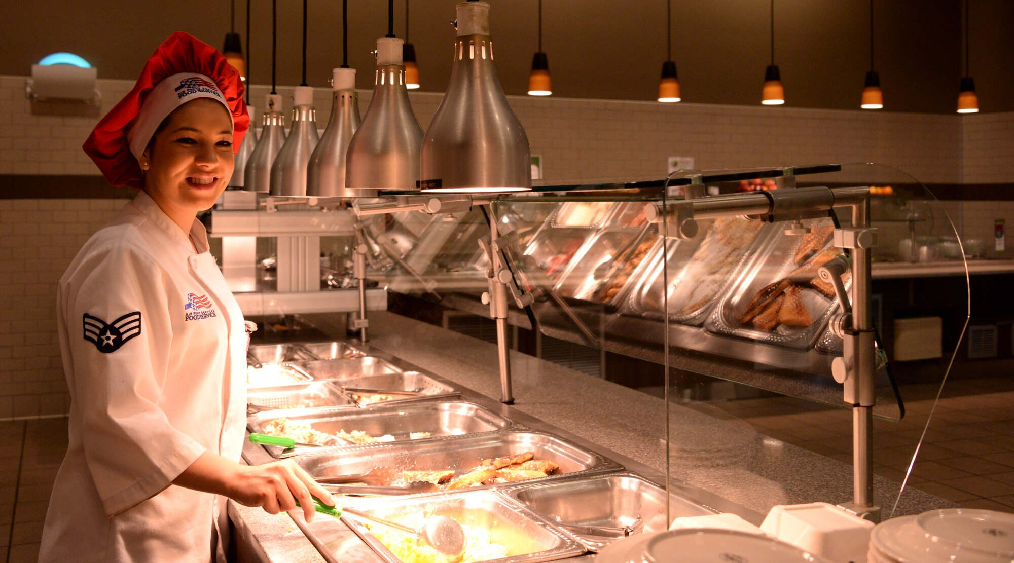 Senior Airman Alyssa Overbay, 60th Force Support Squadron, poses for a photo at Travis Air Force Base, Calif., May 17, 2016. Overbay is a food service shift leader at the Sierra Inn Dining Facility. (U.S. Air Force photo by Senior Airman Amber Carter)