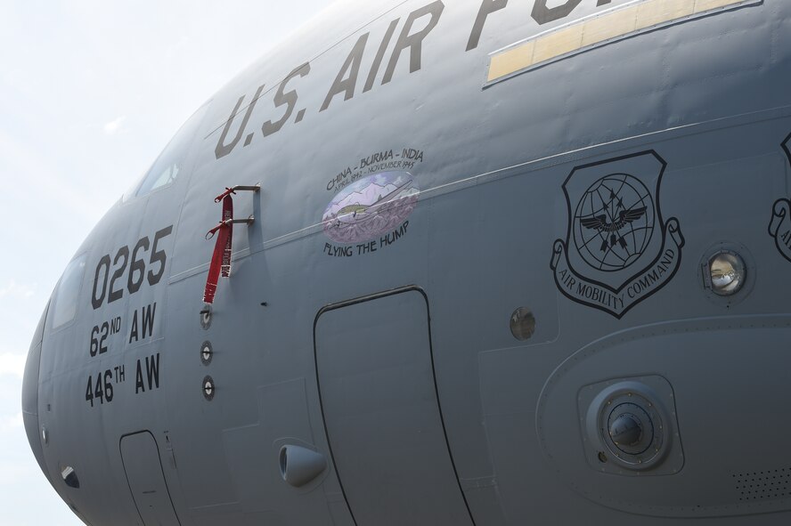 A 62nd Airlift Wing C-17 Globemaster III has the nose art of “Flying the Hump” applied to it May 12, 2016 at Joint Base Lewis-McChord, Wash. The name comes from the airlift missions, known as flying the hump, that were flown over the Himalayan Mountains between India and China from 1943 to 1945 involving U.S. C-46 Commandos and C-47 Skytrains. (U.S. Air Force photo/Staff. Sgt. Naomi Shipley) 