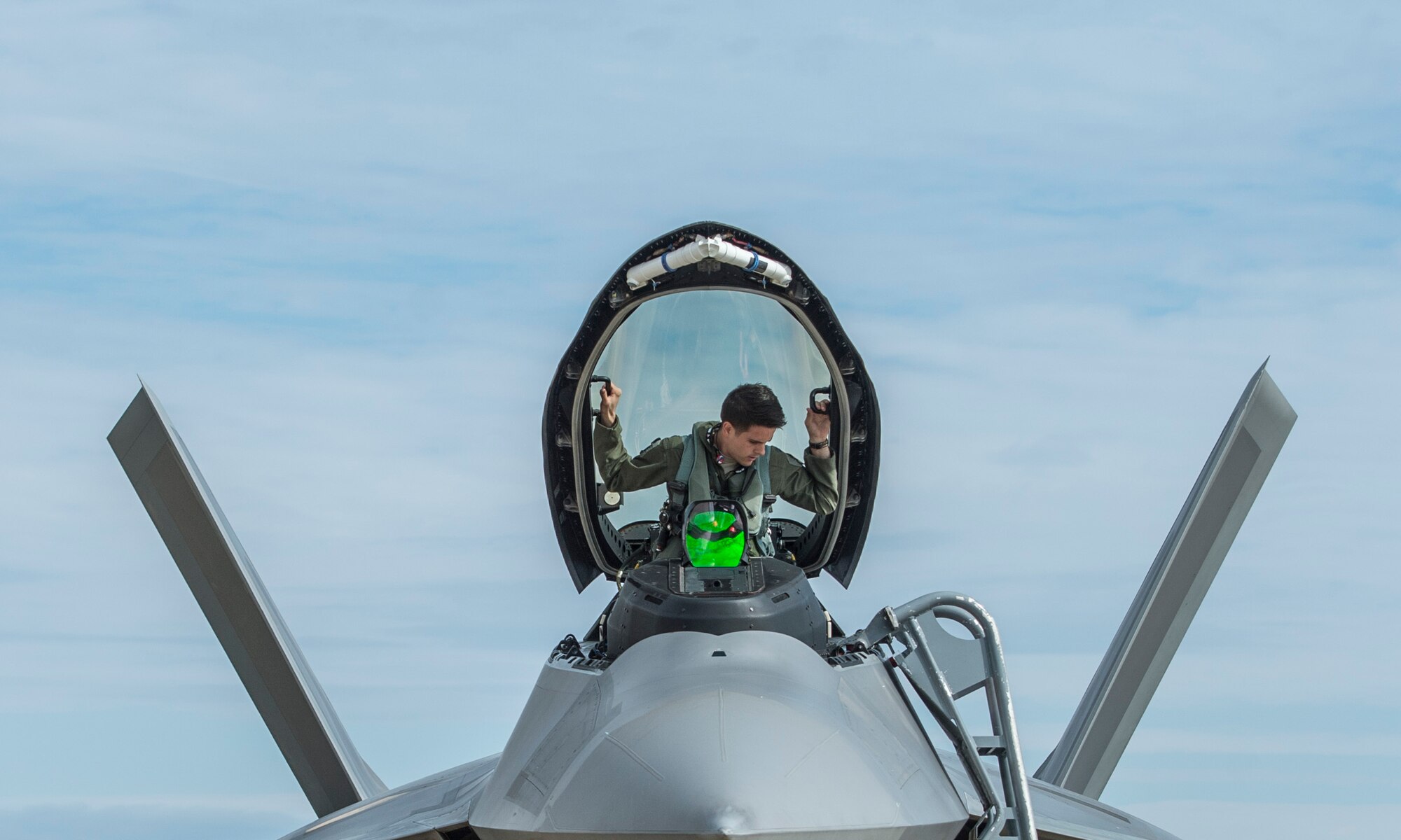 A U.S. Air Force pilot assigned to the 94th Fighter Squadron enters an F-22 Raptor at Langley Air Force Base, Va., May 19, 2016. Approximately 15 Raptors deployed to Joint Base Elmendorf-Richardson, Alaska, to participate in exercise Red Flag-Alaska 16-2 and Distant Frontier. (U.S. Air Force photo by Senior Airman Kayla Newman)
