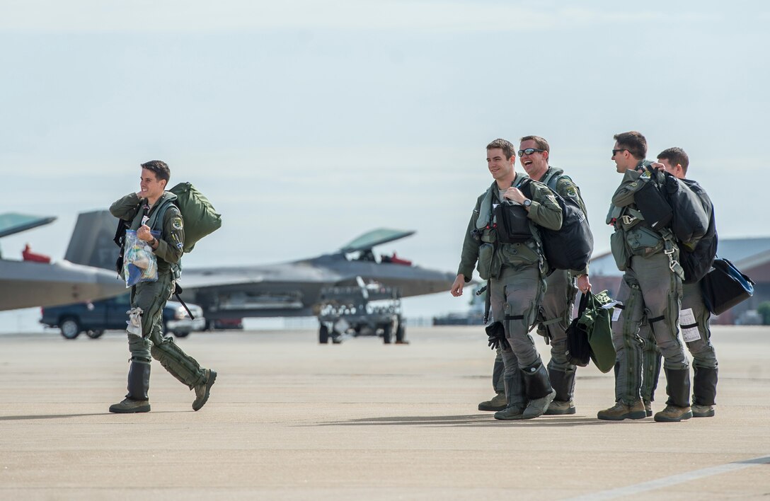 U.S. Air Force pilots assigned to the 94th Fighter Squadron walk to their aircraft at Langley Air Force Base, Va., May 19, 2016. The pilots and members from the 94th FS deployed to Joint Base Elmendorf-Richardson, Alaska, to participate in exercise Red Flag-Alaska 16-2 and Distant Frontier. (U.S. Air Force photo by Senior Airman Kayla Newman) 