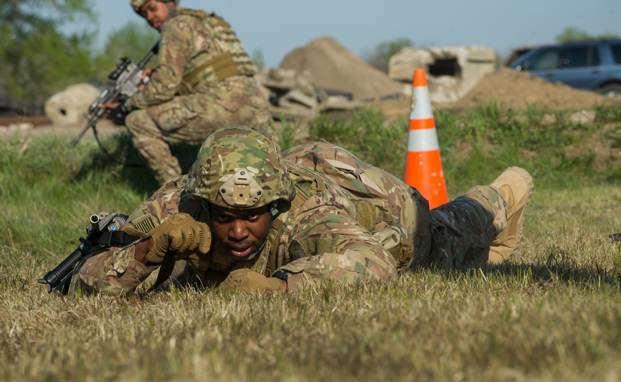 Senior Airman Kerron Henry, 791st Missile Security Forces Squadron defender, prepares to low craw during training at Minot Air Force Base, N.D., May 16, 2016. The training honed the defenders’ tactical skills. (U.S. Air Force photo/Senior Airman Apryl Hall)