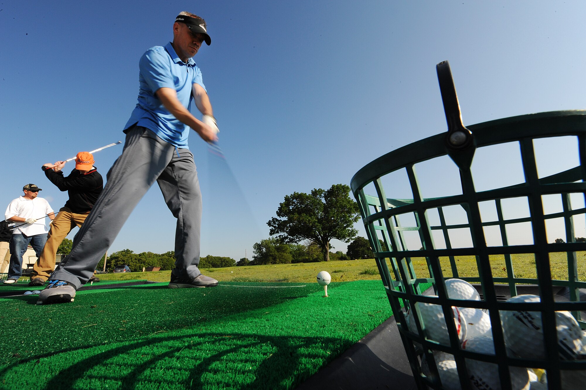 U.S. Air Force Capt. John Sullivan, a 509th Security Forces Squadron operations officer, practices driving before the National Police Week golf outing at the Royal Oaks Golf Course in Knob Noster, Mo., May 18, 2016. National Police Week was established to recognize law enforcement officers who made the ultimate sacrifice for the protection of others. Whiteman Air Force Base honored the week with events such as a vigil for fallen law-enforcement officers, a memorial 5K run and a base-wide tournament which included golf, bowling, softball and other games. (U.S. Air Force photo by Airman 1st Class Michaela R. Slanchik)